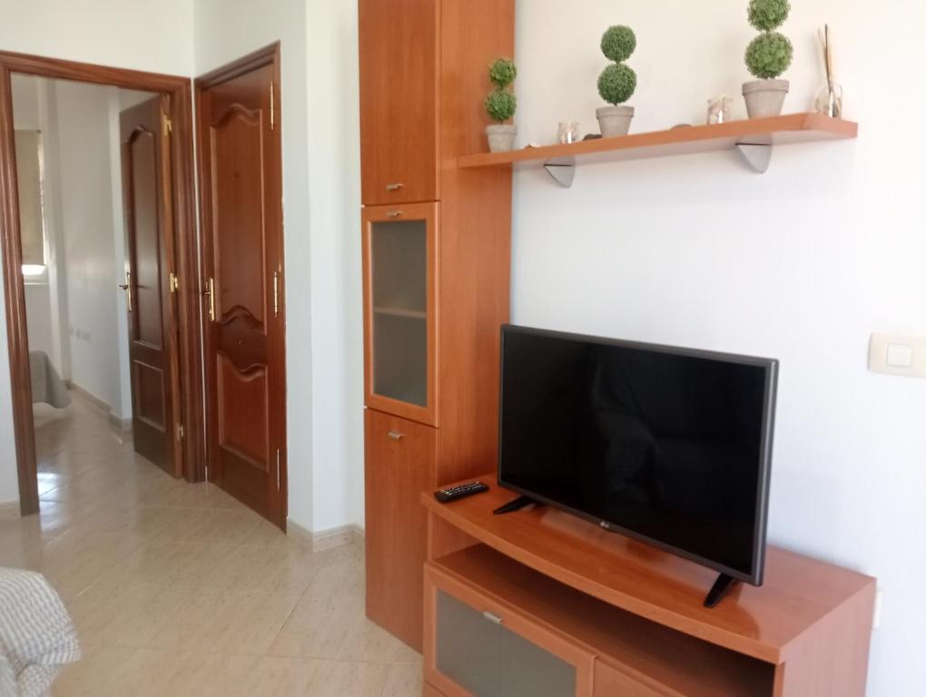 TV a/nebo společenská místnost v ubytování Casa Alberto