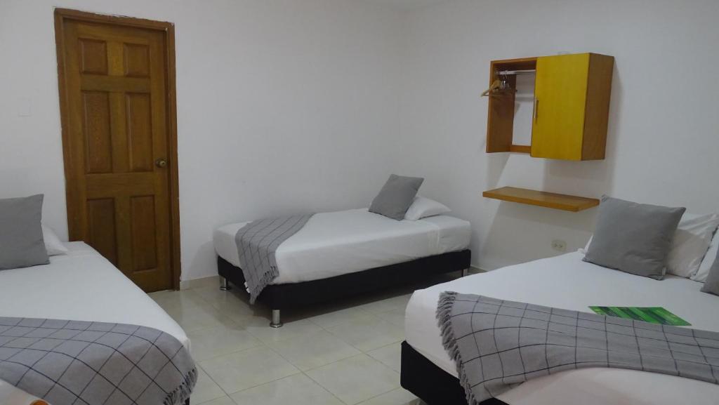 Postel nebo postele na pokoji v ubytování Hotel Casa Finca La Maracuya