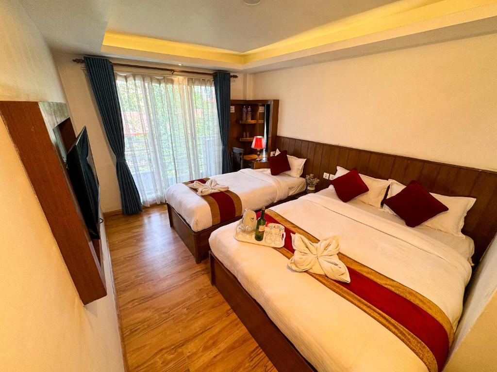 Postel nebo postele na pokoji v ubytování Hotel Abi International