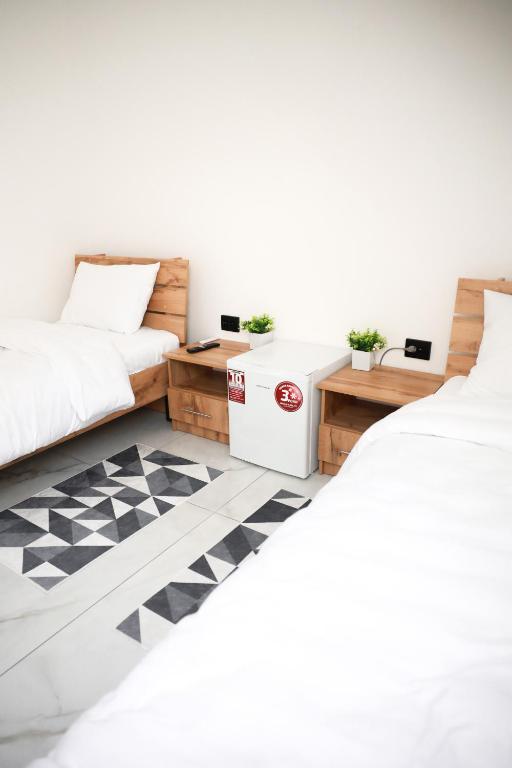 Postel nebo postele na pokoji v ubytování M-23 Hotel