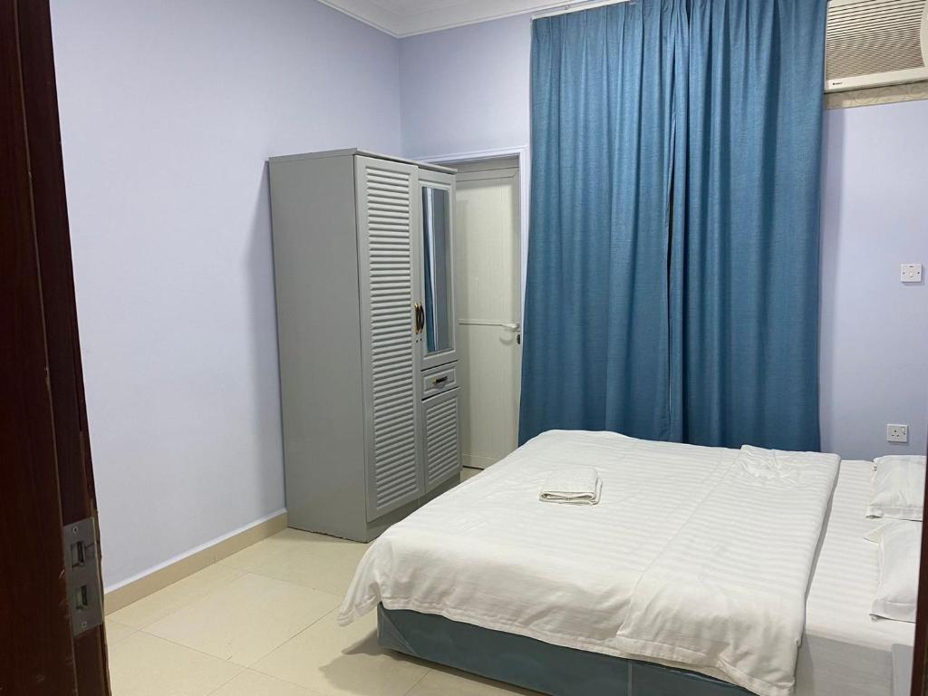 Postel nebo postele na pokoji v ubytování Salalah-Al Shwamekh Suites