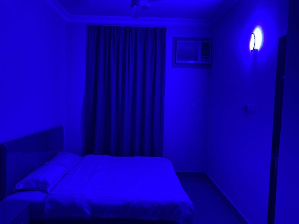Postel nebo postele na pokoji v ubytování Salalah-Al Shwamekh Suites