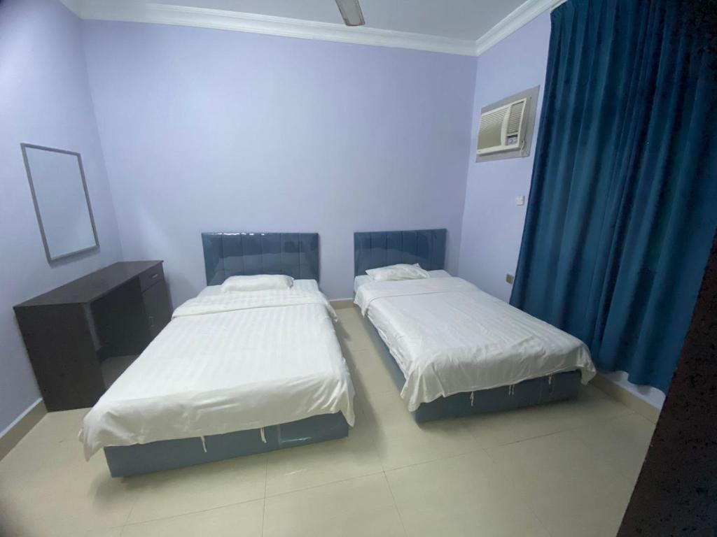 Postel nebo postele na pokoji v ubytování Salalah-Al Shwamekh Suites