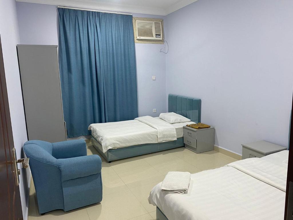 Postel nebo postele na pokoji v ubytování Salalah-Al Shwamekh Suites