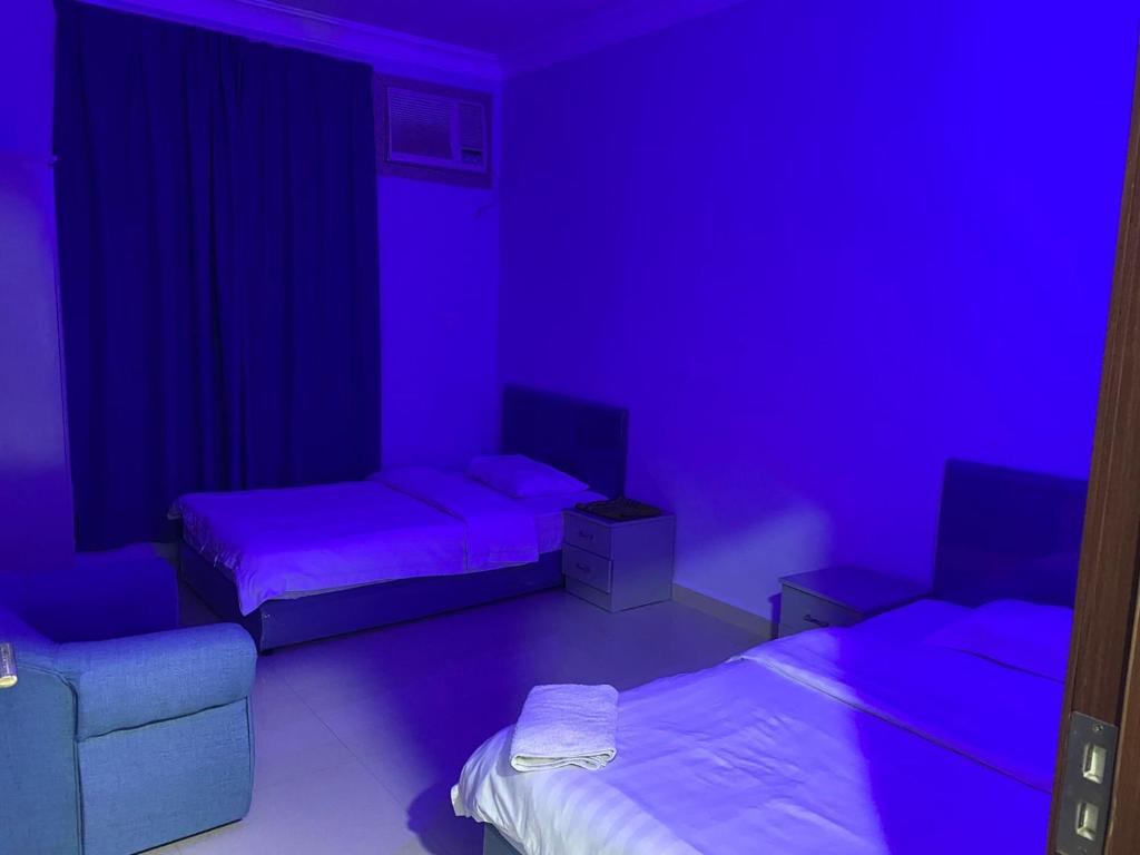 Postel nebo postele na pokoji v ubytování Salalah-Al Shwamekh Suites