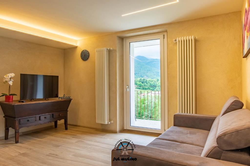 TV a/nebo společenská místnost v ubytování Residenza SUL MULINO