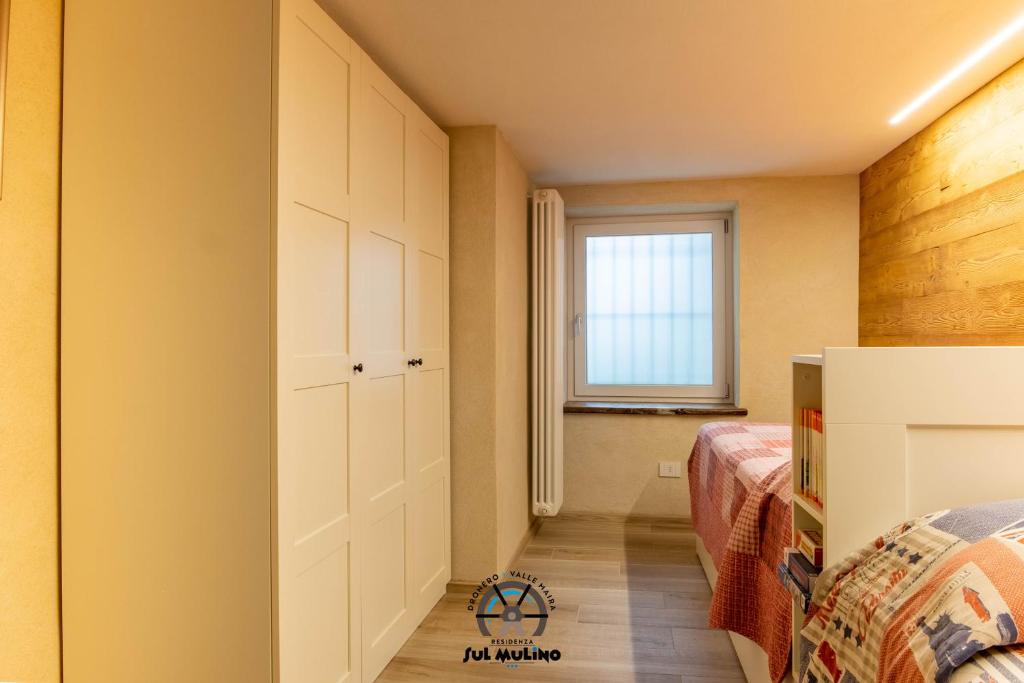 Postel nebo postele na pokoji v ubytování Residenza SUL MULINO