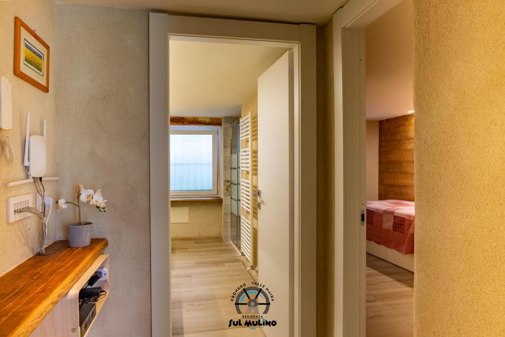 Postel nebo postele na pokoji v ubytování Residenza SUL MULINO