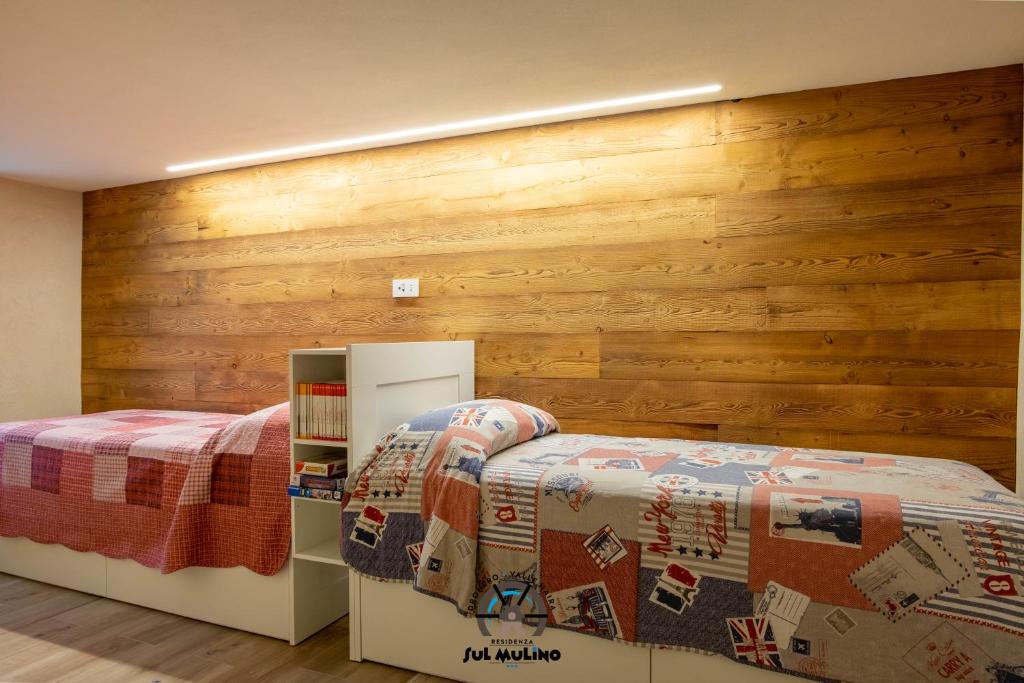 Postel nebo postele na pokoji v ubytování Residenza SUL MULINO