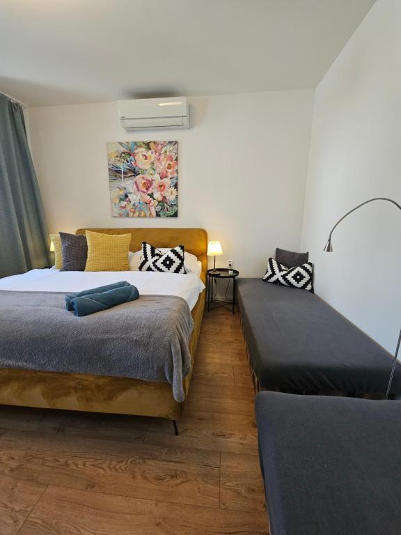 Posteľ alebo postele v izbe v ubytovaní Apartmány Centro & Jacuzzi