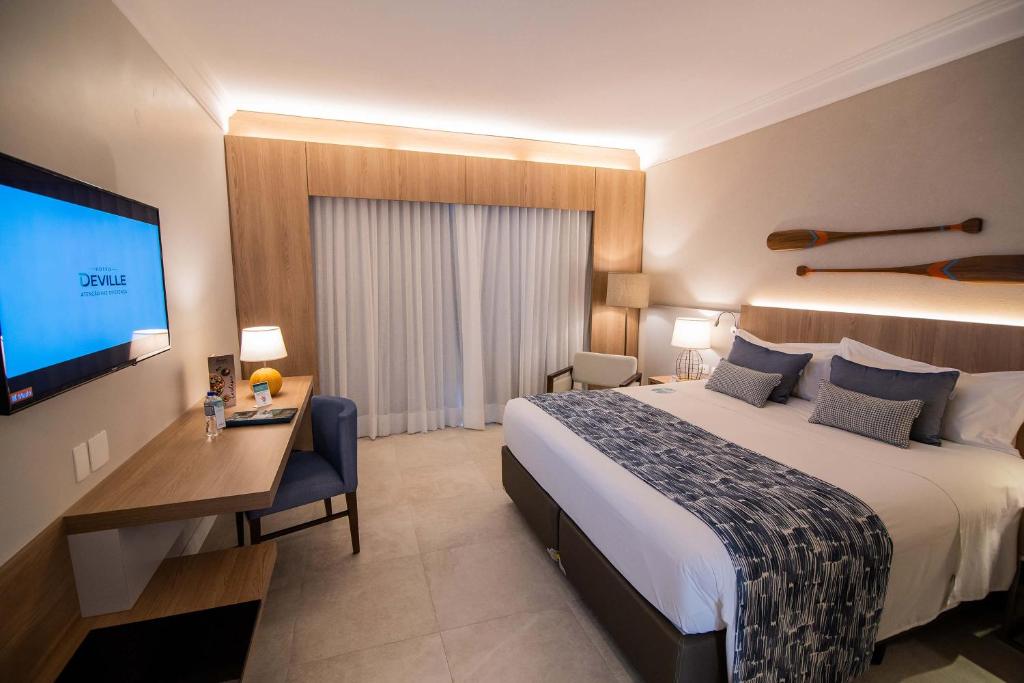 Postel nebo postele na pokoji v ubytování Hotel Deville Prime Salvador