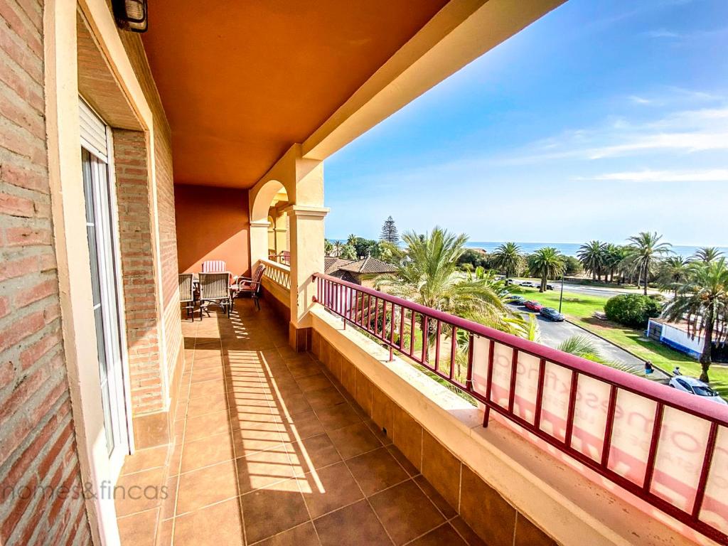 a balcony of a house with a view of the ocean at 3 Bed Beach Apartment with views Isla Canela in Isla Canela