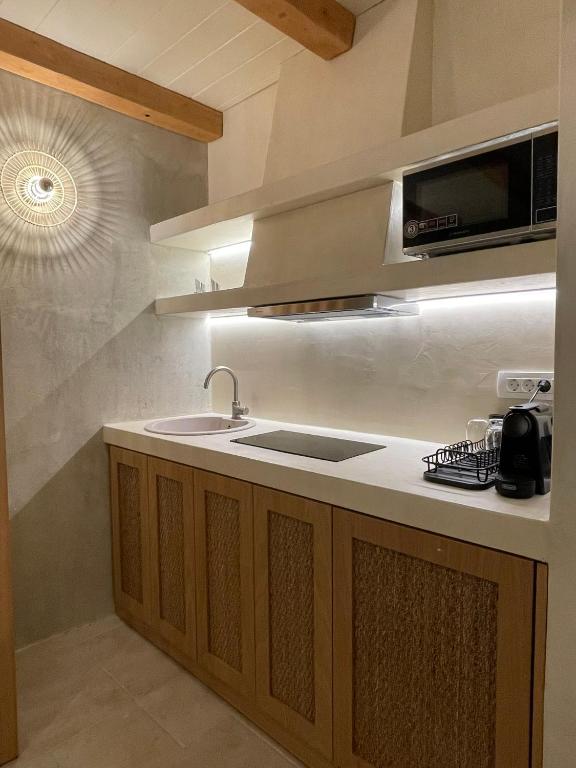 Kuchyň nebo kuchyňský kout v ubytování Solo Sole Suites Santorini