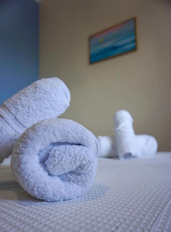 Postel nebo postele na pokoji v ubytování Theros