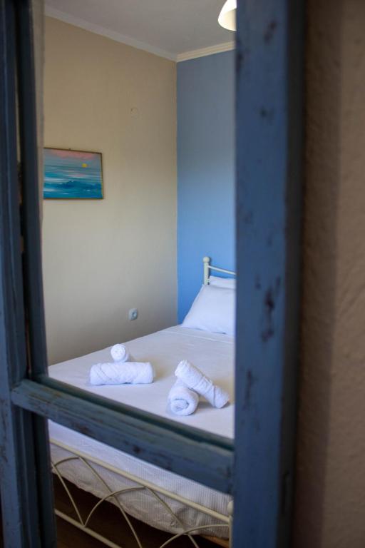Postel nebo postele na pokoji v ubytování Theros