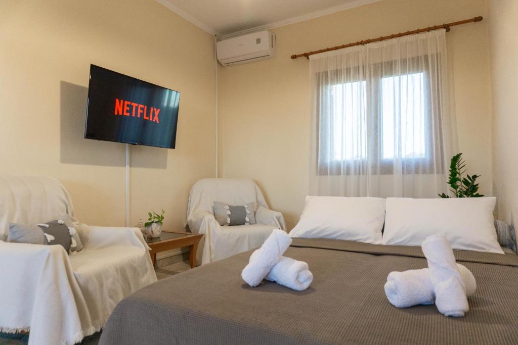 Postel nebo postele na pokoji v ubytování Theros