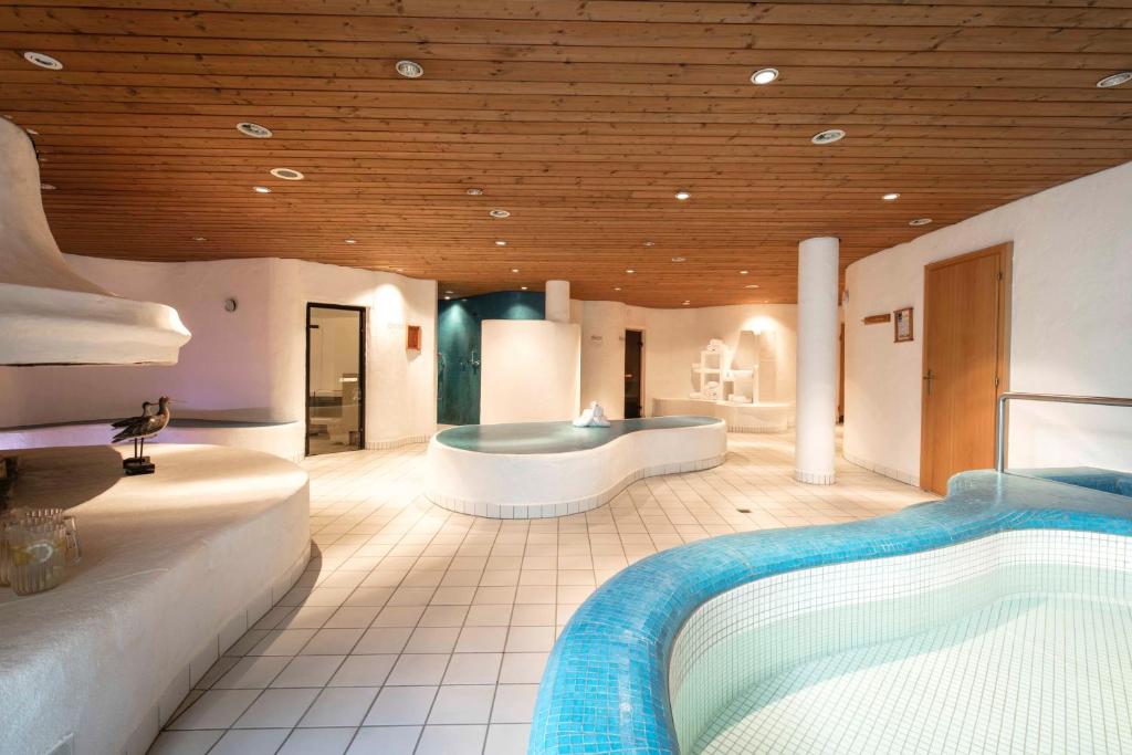 Posteľ alebo postele v izbe v ubytovaní Sporthotel by Alpenlodge