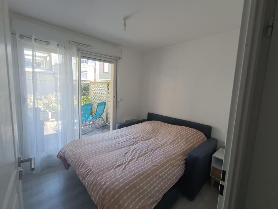 Postel nebo postele na pokoji v ubytování appartement la mer