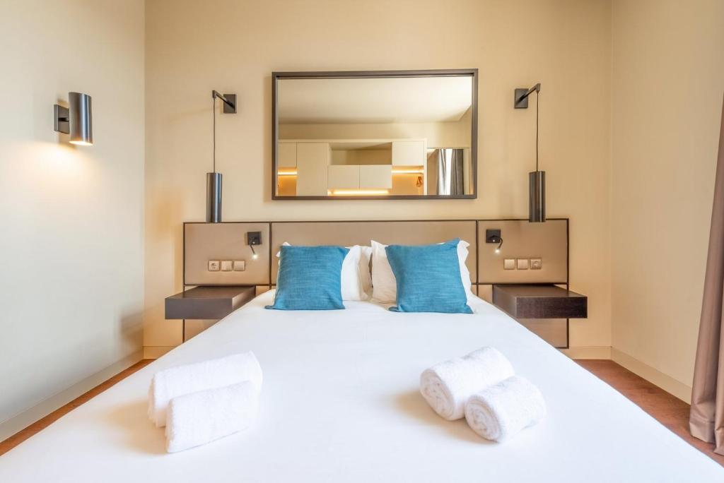 Postel nebo postele na pokoji v ubytování GuestReady - Time Out 106