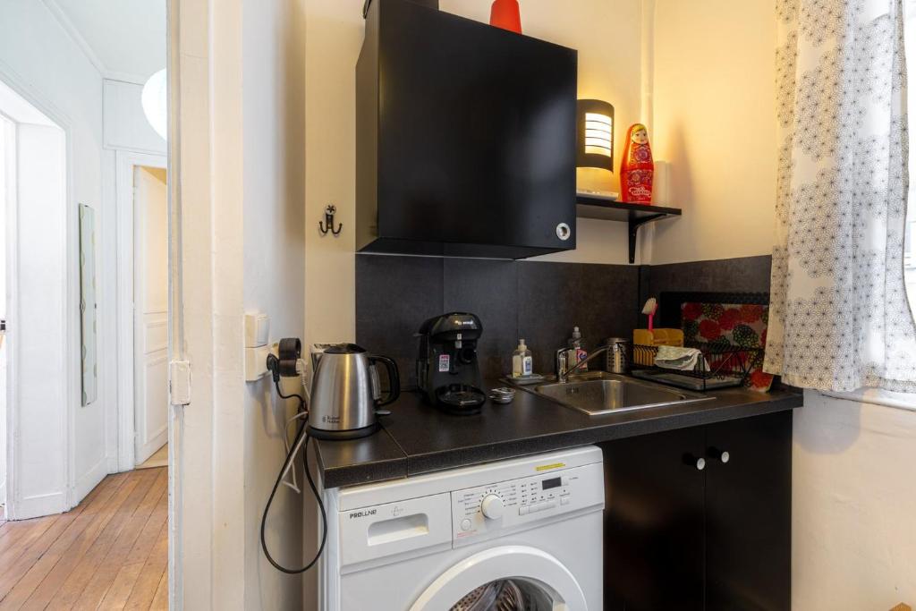 Köök või kööginurk majutusasutuses GuestReady - Apt Chaleureux dans le 5e arrondissement