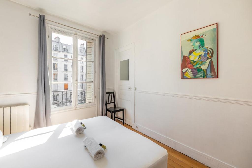 Voodi või voodid majutusasutuse GuestReady - Apt Chaleureux dans le 5e arrondissement toas