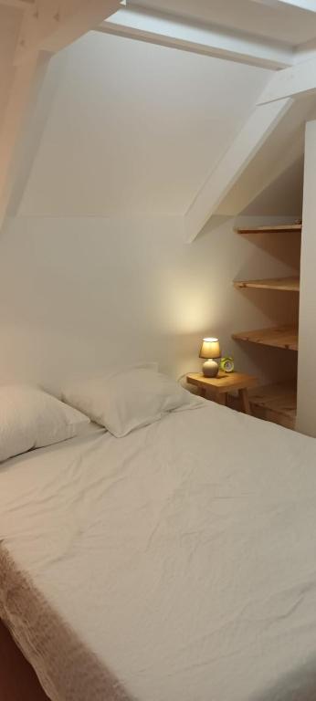 Postel nebo postele na pokoji v ubytování Gîte du Colombier