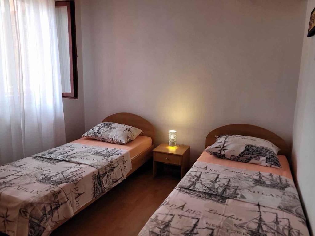 Łóżko lub łóżka w pokoju w obiekcie Apartment Valbandon, Istia 3