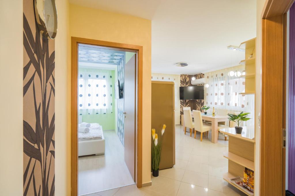 a room with a dining room and a living room at ★ BB Wellness Apartman ★ in Siófok