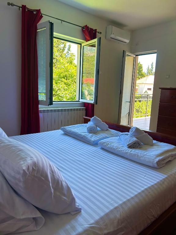 Postel nebo postele na pokoji v ubytování Vila CarpeDiem