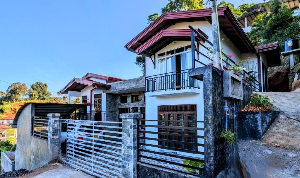 a house with a gate in front of it at Villa Sanseya Kandy in Peradeniya