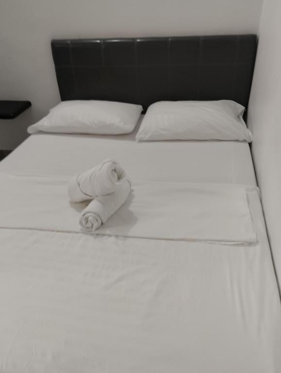 Postel nebo postele na pokoji v ubytování Hotel Ozzy