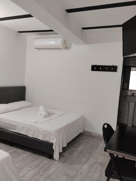 Postel nebo postele na pokoji v ubytování Hotel Ozzy