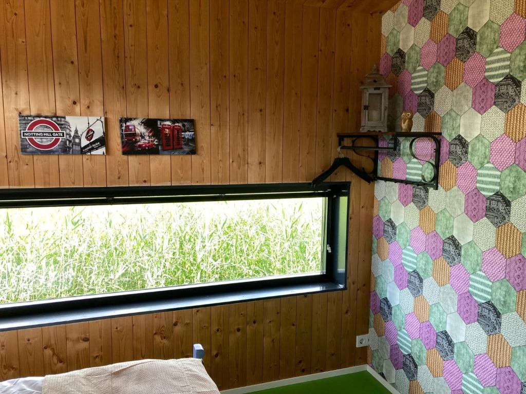 Postel nebo postele na pokoji v ubytování 't UijlenHuijs