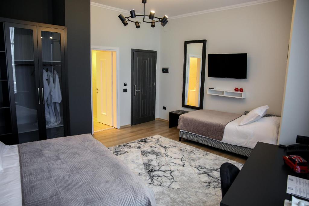 Postel nebo postele na pokoji v ubytování Sky Hotel Korce