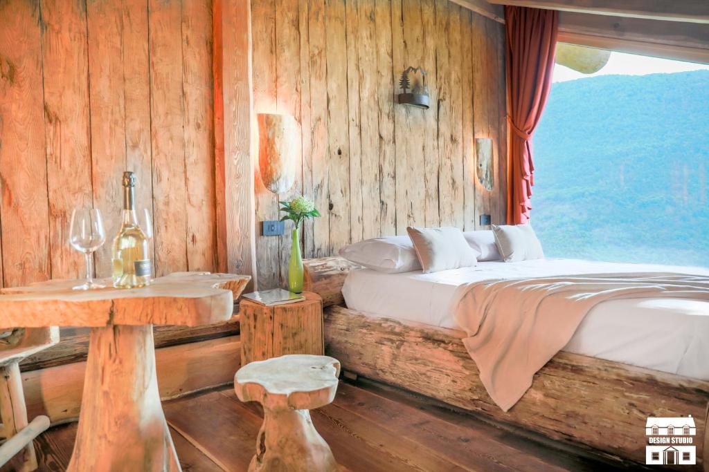 Postel nebo postele na pokoji v ubytování CHALET ANTICO LEGNO by Design Studio