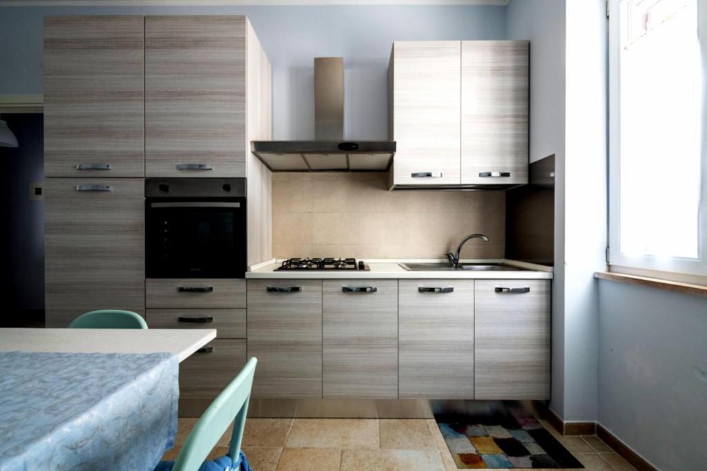 Kuchyň nebo kuchyňský kout v ubytování Riva Vieste Suites