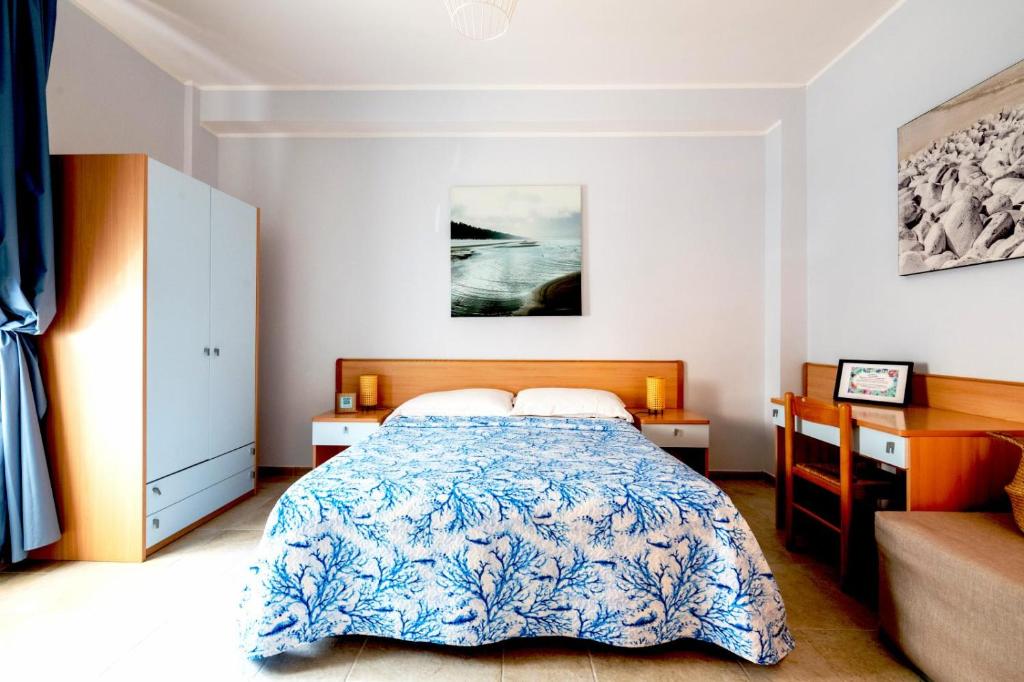 Postel nebo postele na pokoji v ubytování Riva Vieste Suites