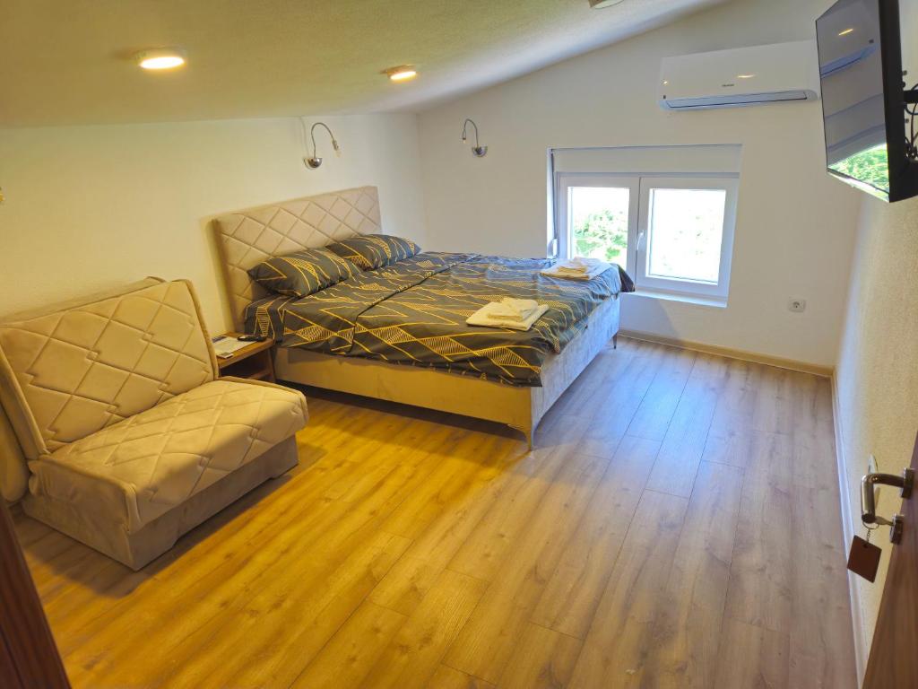 Postel nebo postele na pokoji v ubytování Rooms & Spa BJELASICA