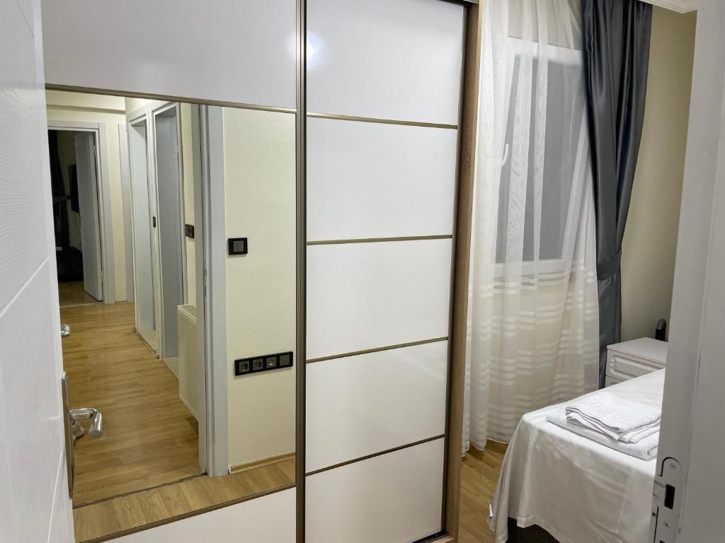 Postel nebo postele na pokoji v ubytování Köseoğlu APART