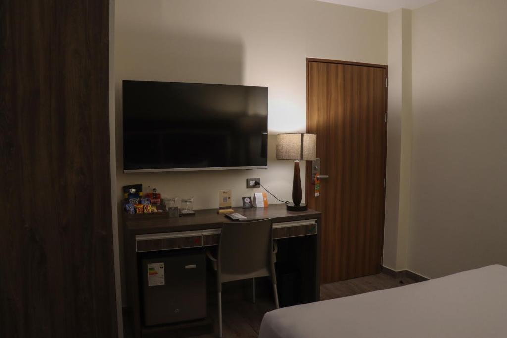 TV a/nebo společenská místnost v ubytování Rado Hotel - Quintanas
