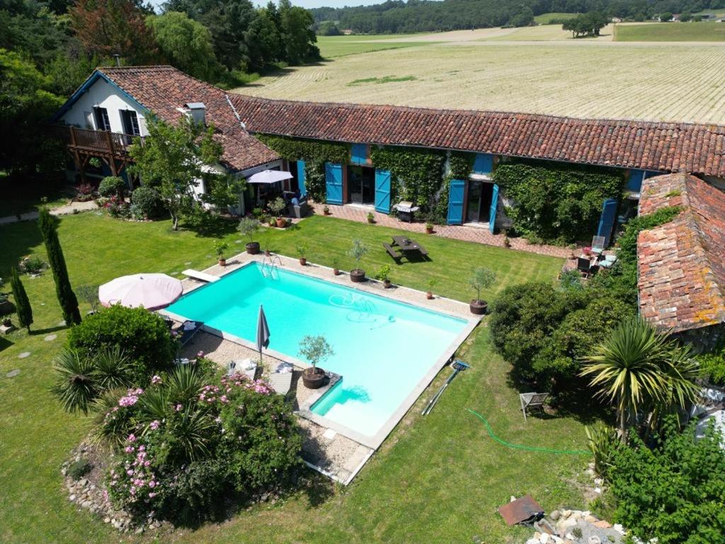 an aerial view of a house with a swimming pool at Domaine Du Tafiart in Sarron