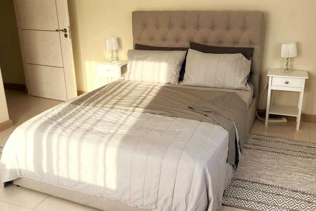 a bedroom with a large bed with two night stands at Mountridge Lodge in Prospect