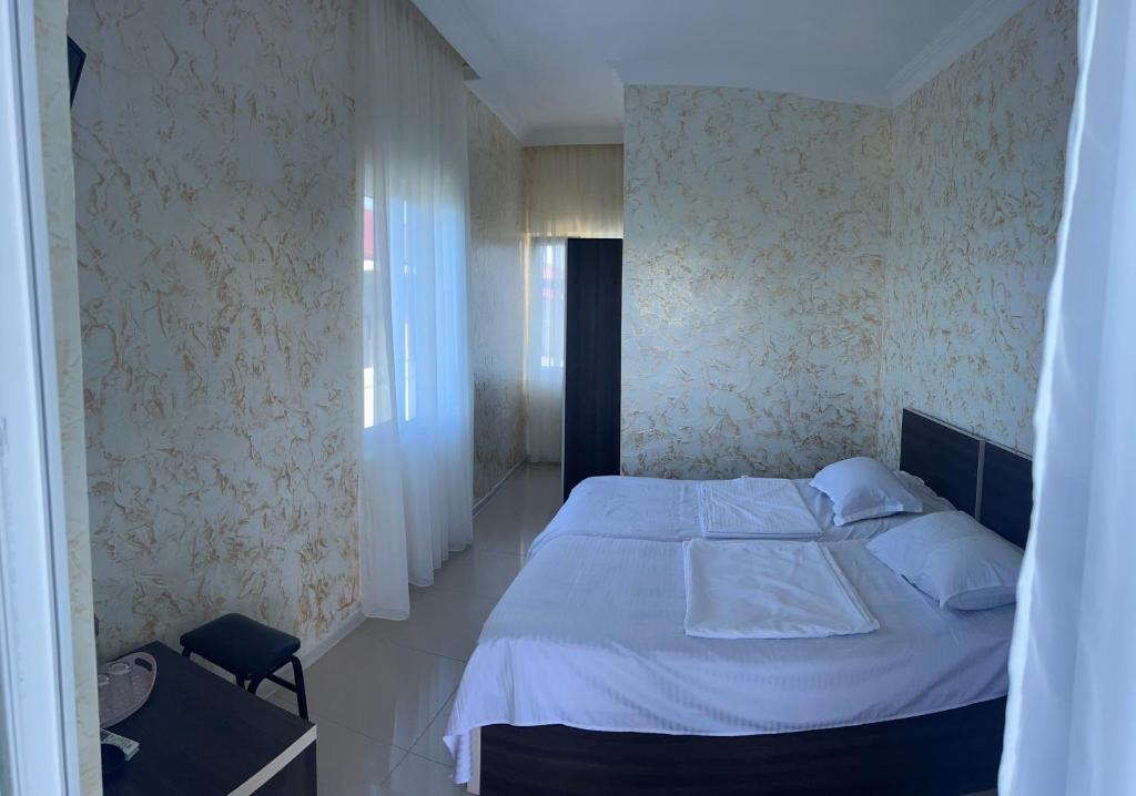 Postel nebo postele na pokoji v ubytování Inn David