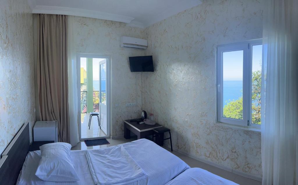 Postel nebo postele na pokoji v ubytování Inn David