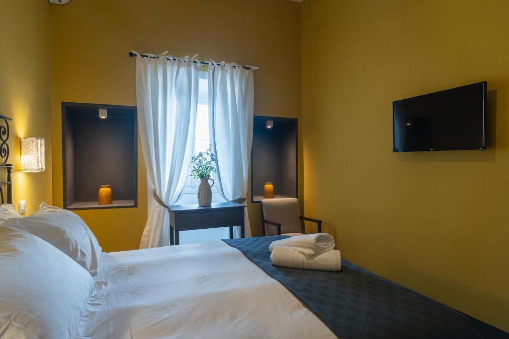 Postel nebo postele na pokoji v ubytování Masseria La Presentina
