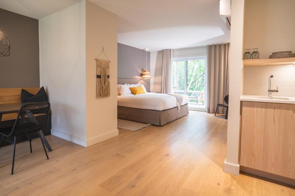Postel nebo postele na pokoji v ubytování Suites du Lac Moore