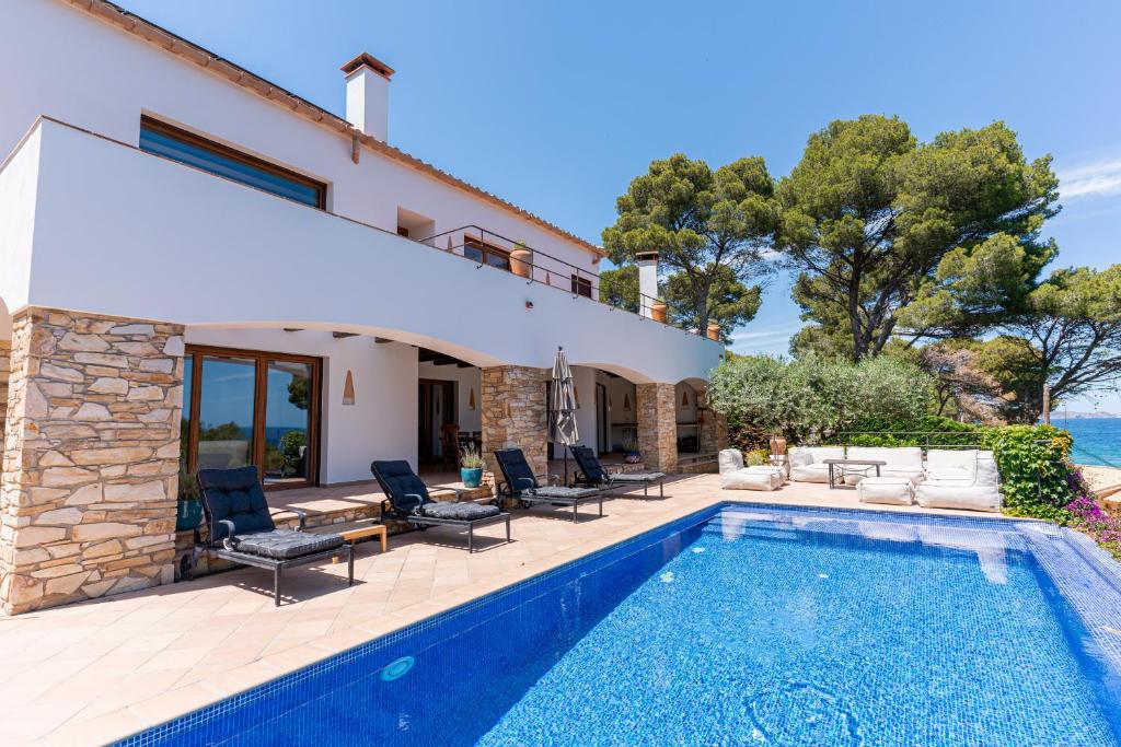 an image of a villa with a swimming pool at La Isla in Sa-Riera