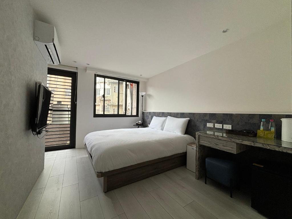 Voodi või voodid majutusasutuse Lai Jie Accommodation新北市民宿411號 toas