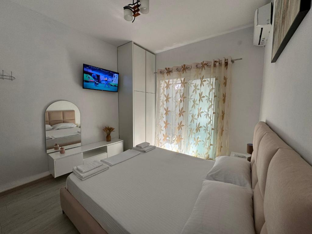 Postel nebo postele na pokoji v ubytování Dadaj Apartments