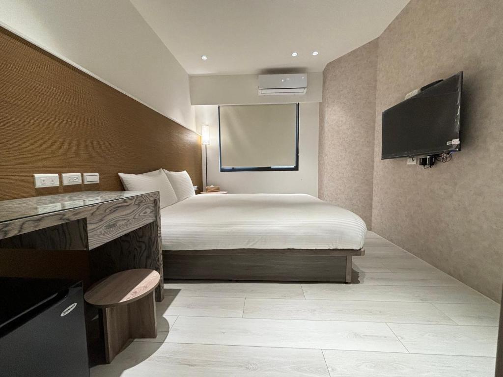 Televiisor ja/või meelelahutuskeskus majutusasutuses Lai Jie Accommodation新北市民宿411號
